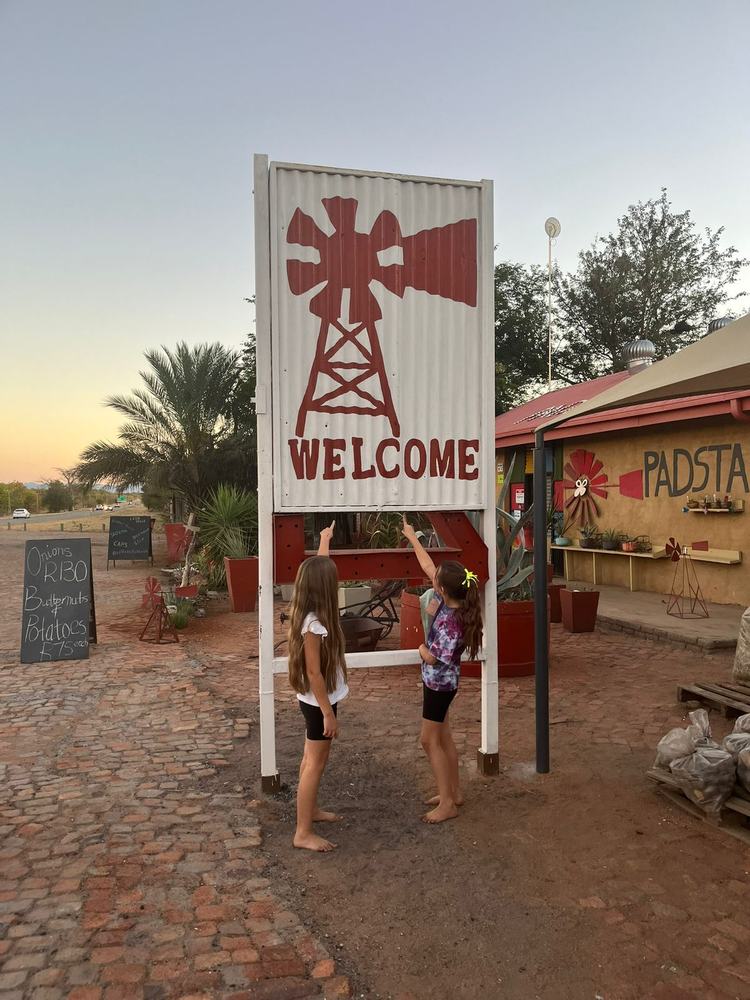 Welcome sign at farm entrance