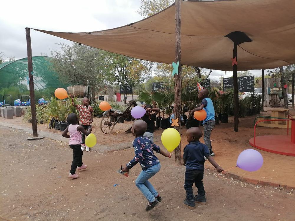Children playing with balloons