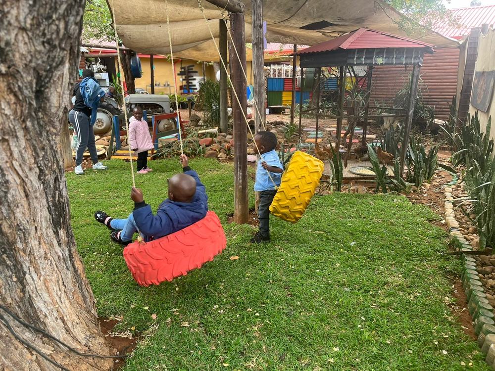 Tire swing and playground area